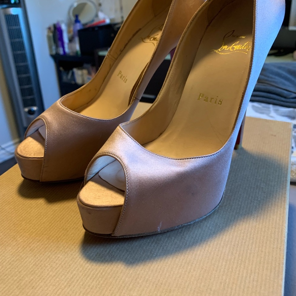 Pink silk Louboutins.